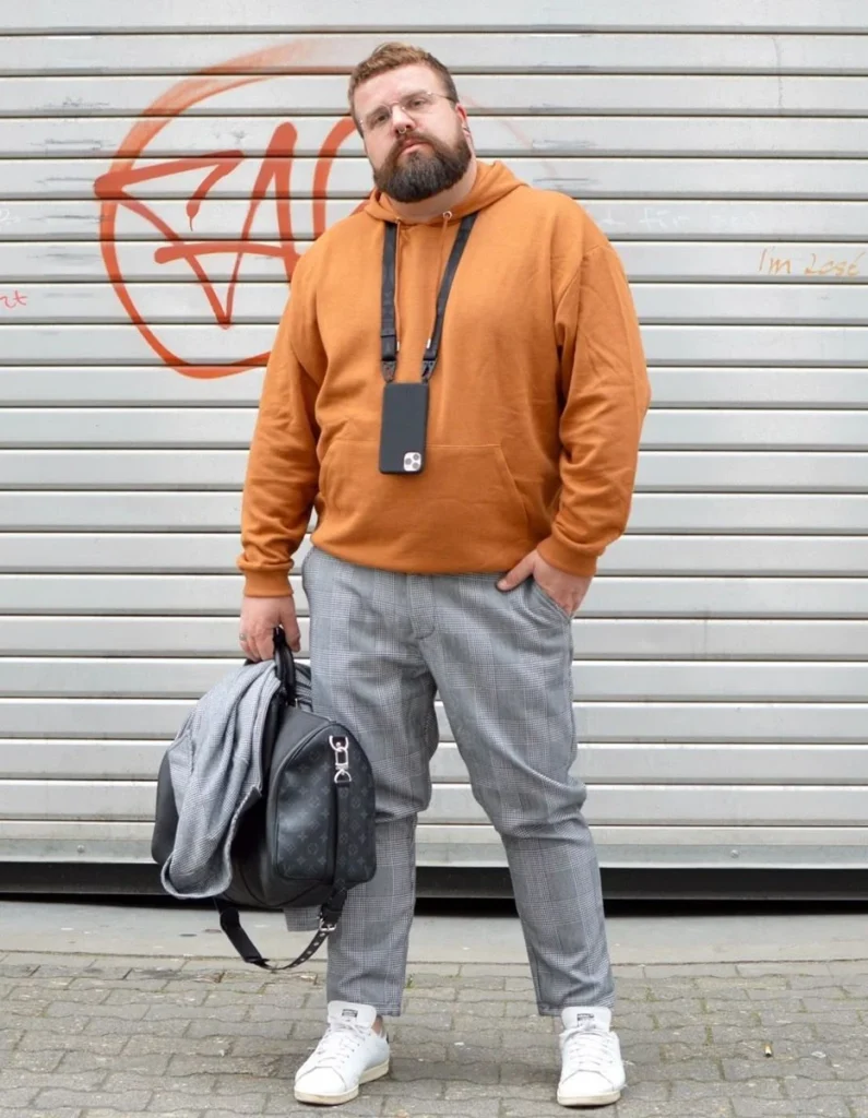 1. Burnt Orange Hoodie With Plaid Trousers
