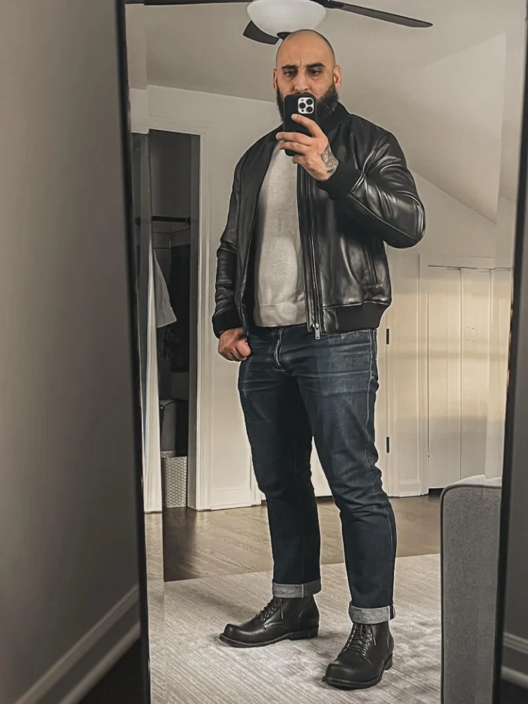 11. Leather Bomber With Gray Sweatshirt and Cuffed Denim
