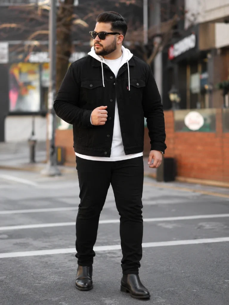 15. Black Denim Jacket Over a White Hoodie