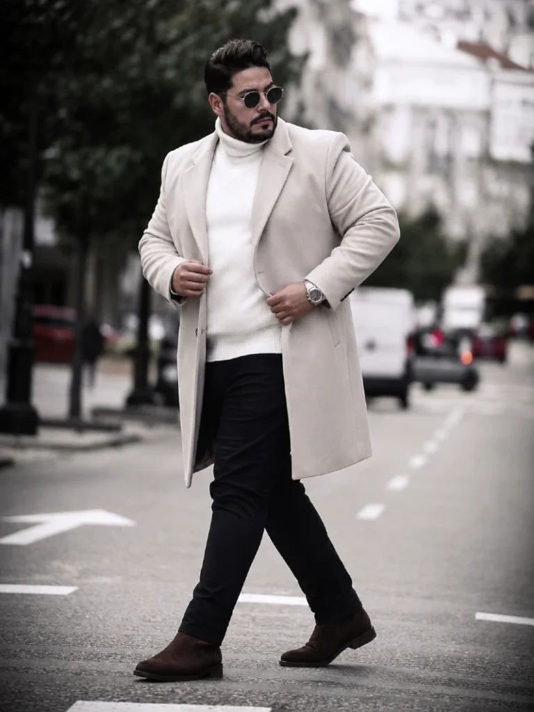 15. Cream Overcoat With White Turtleneck and Dark Pants