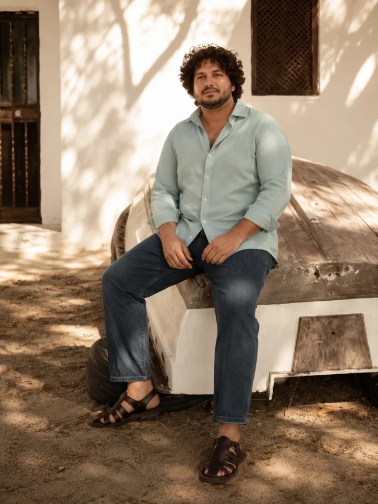 16. Aqua Linen Shirt, Straight Jeans, and Brown Fisherman Sandals
