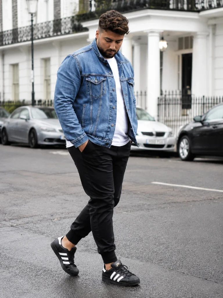 16. Denim Jacket With Joggers and Black Sneakers