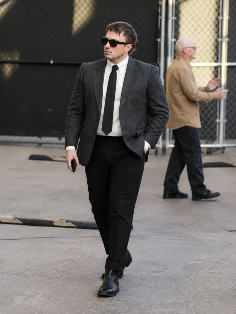 16. Grey Blazer With Black Tie and Chelsea Boots