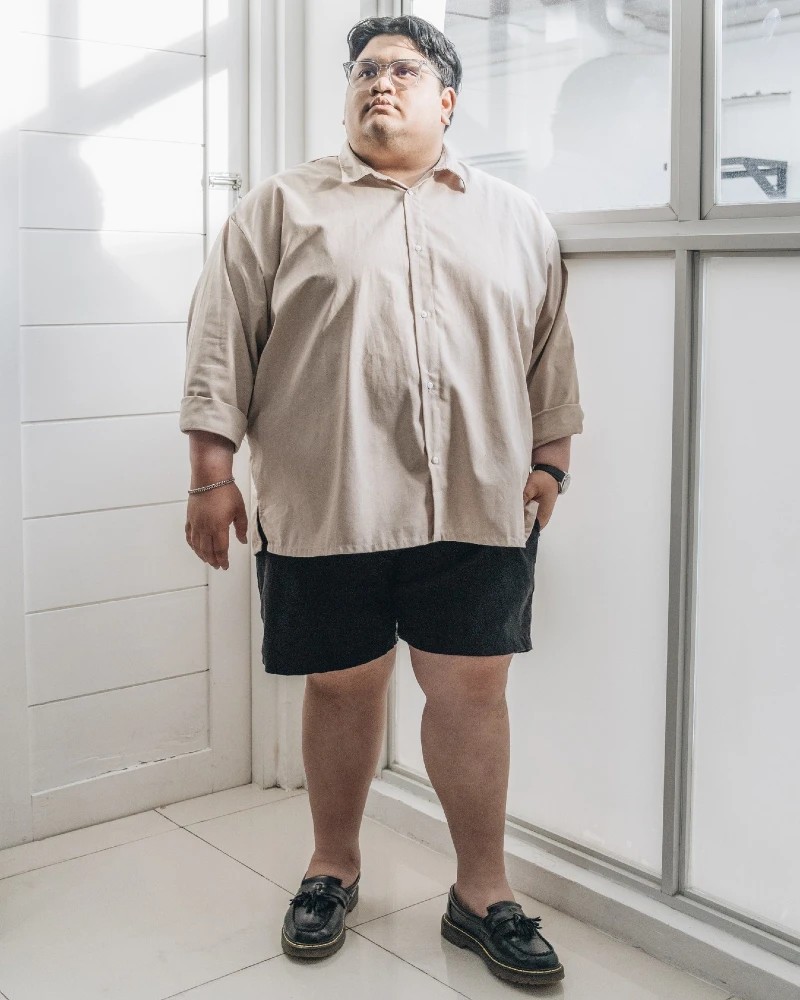 18. Beige Boxy Shirt With Black Shorts