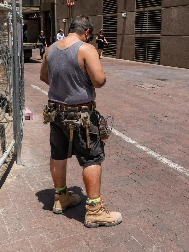18. Gray Tank, Tool Belt, and Tan Work Boots