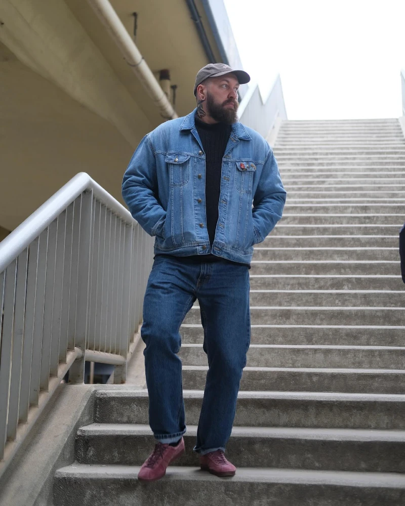 7. Relaxed Denim Jacket With Black Knit and Purple Sneakers