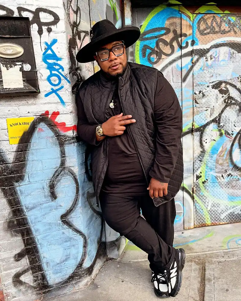 All-Black Layers With a Quilted Vest and Chunky Sneakers