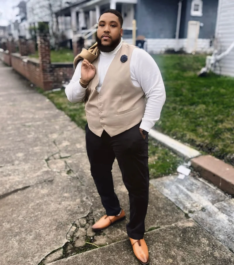 Beige Vest, White Turtleneck, and Dark Trousers