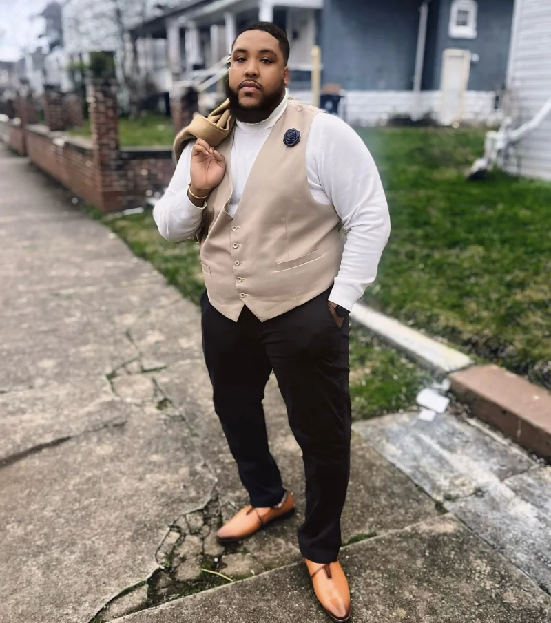 Beige Vest and Dark Trousers