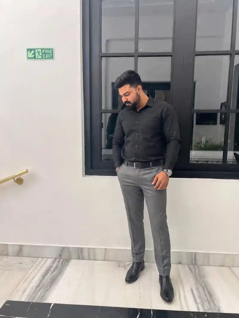 Black Button-Down Shirt and Grey Trousers