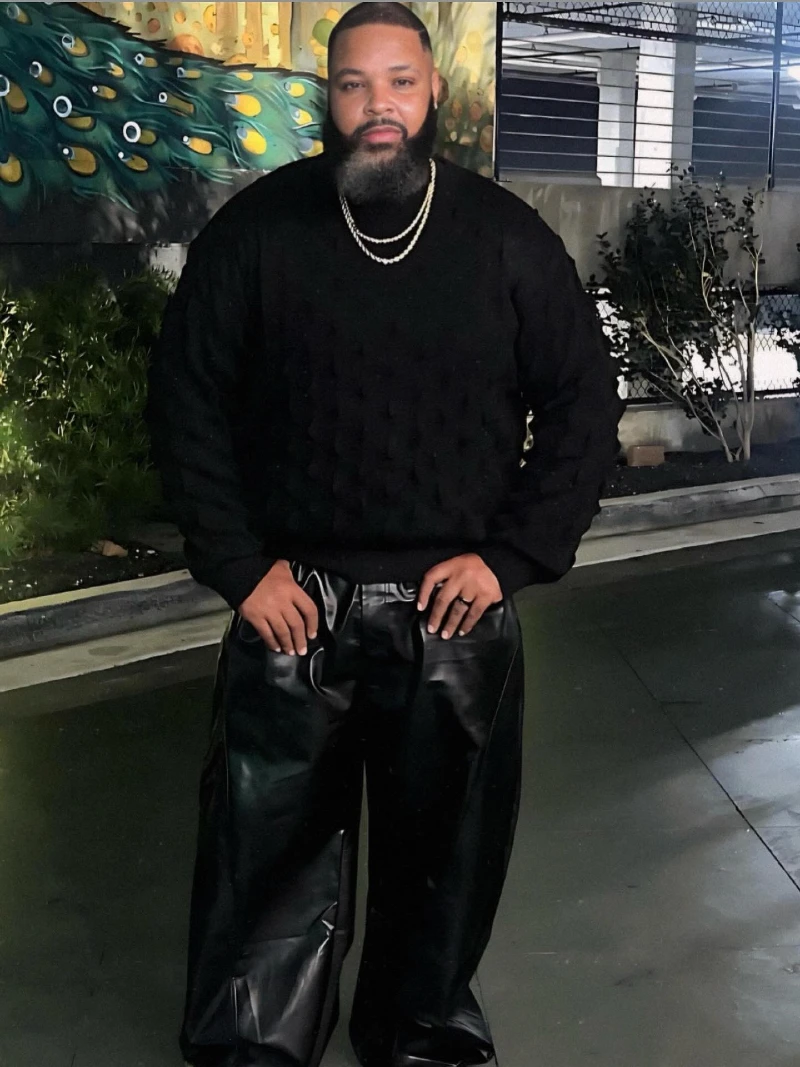 Black Crewneck Sweatshirt and Glossy Black Trousers