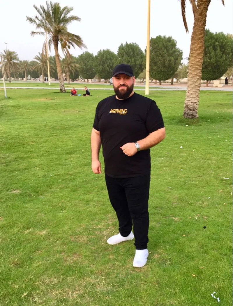 Black Graphic T-Shirt With Black Jeans and White Sneakers
