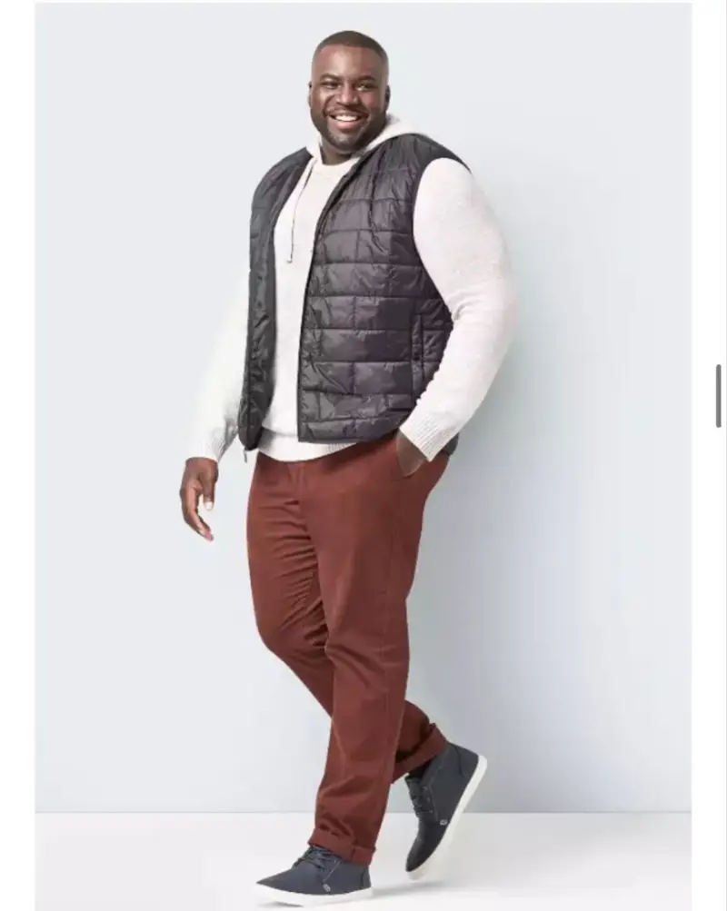 Black Puffer Vest And Rust Chinos