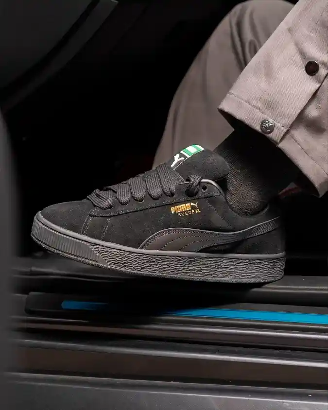Black Suede Sneakers and Grey Trousers