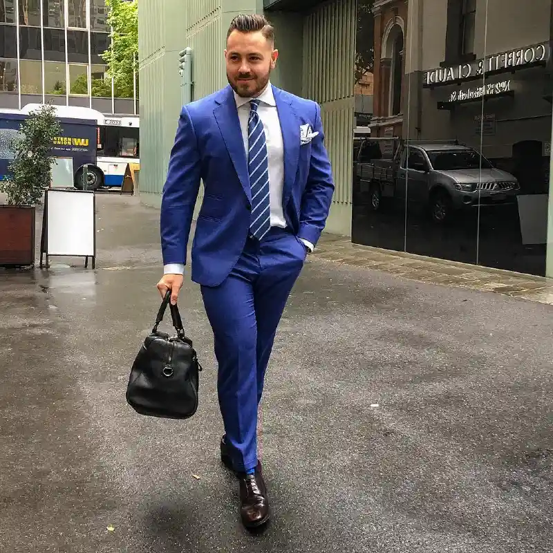 Blue Suit, White Shirt, and Striped Tie