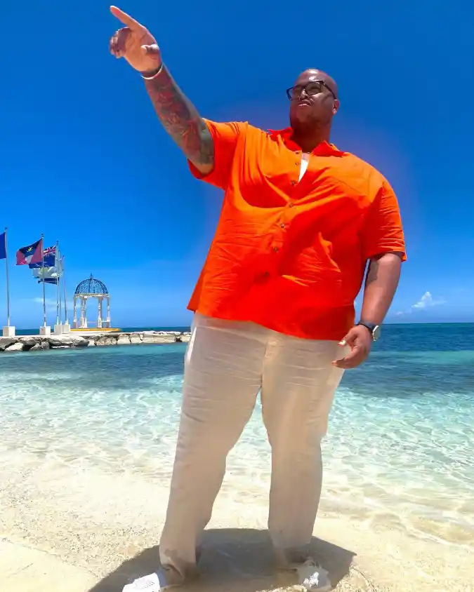 Bright Orange Short-Sleeve Button-Down and Beige Trousers