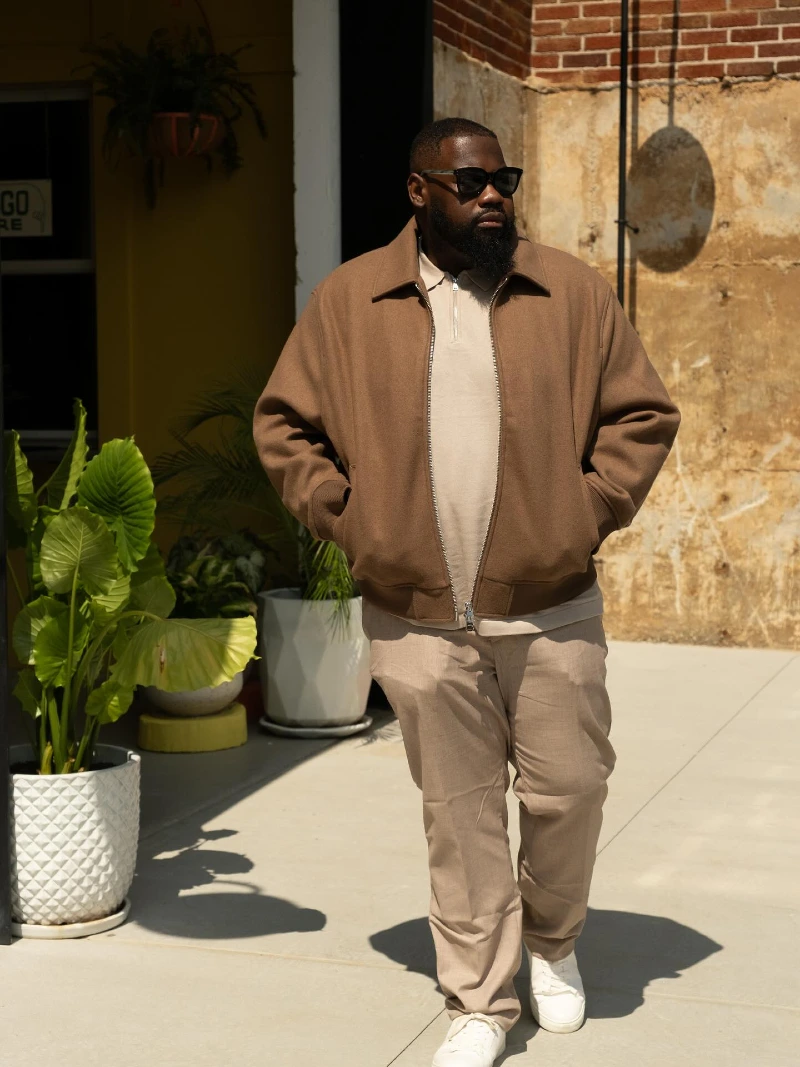 Brown Zip Jacket, Beige Quarter Zip Top, Taupe Trousers and White Sneakers