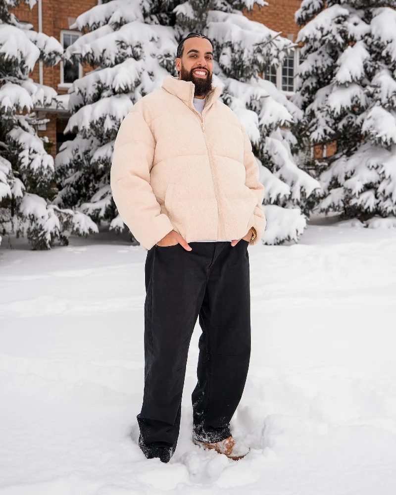 Cream Puffer Jacket with Black Pants and Boots