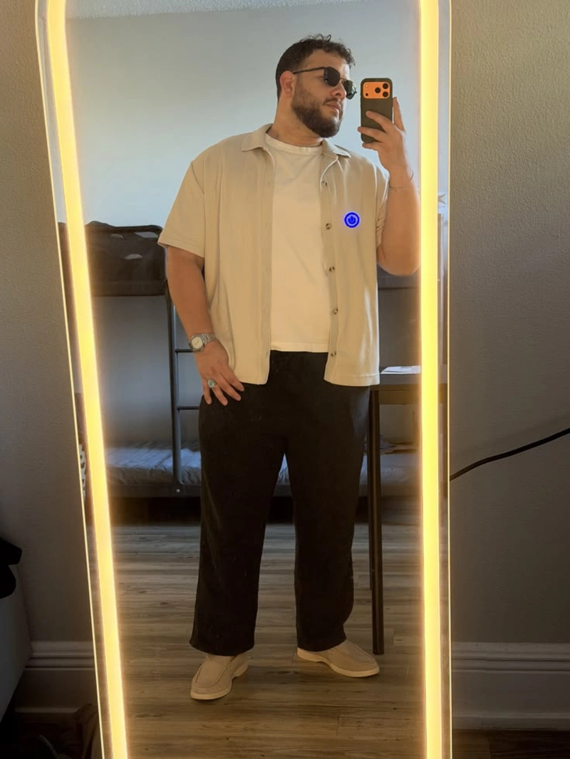 Cream Short-Sleeve Button-Up with White T-Shirt and Black Wide-Leg Pants