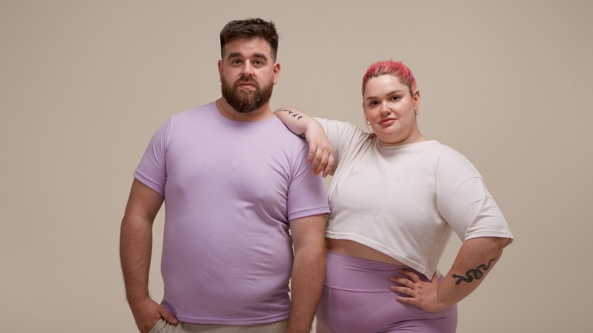 Finding clothes that actually fit a bigger body feels like a frustrating second job. Standard style advice usually completely ignores men with wide shoulders and soft midsections. Brands just add extra fabric to normal patterns, leaving you stuck wearing shapeless tents that drag your whole look down. Dressing up for a nice dinner or a relaxed office should never make you feel stuffed into a tight costume. True confidence comes from understanding exactly how specific cuts and fabrics frame your actual size right now. Heavy guys need structure. Looking polished happens naturally when you stop trying to hide behind oversized items, since small changes in your daily choices make a massive difference in how people see you. Building a sharp wardrobe somewhere between sloppy sweatpants and stiff suits requires learning a few basic rules.