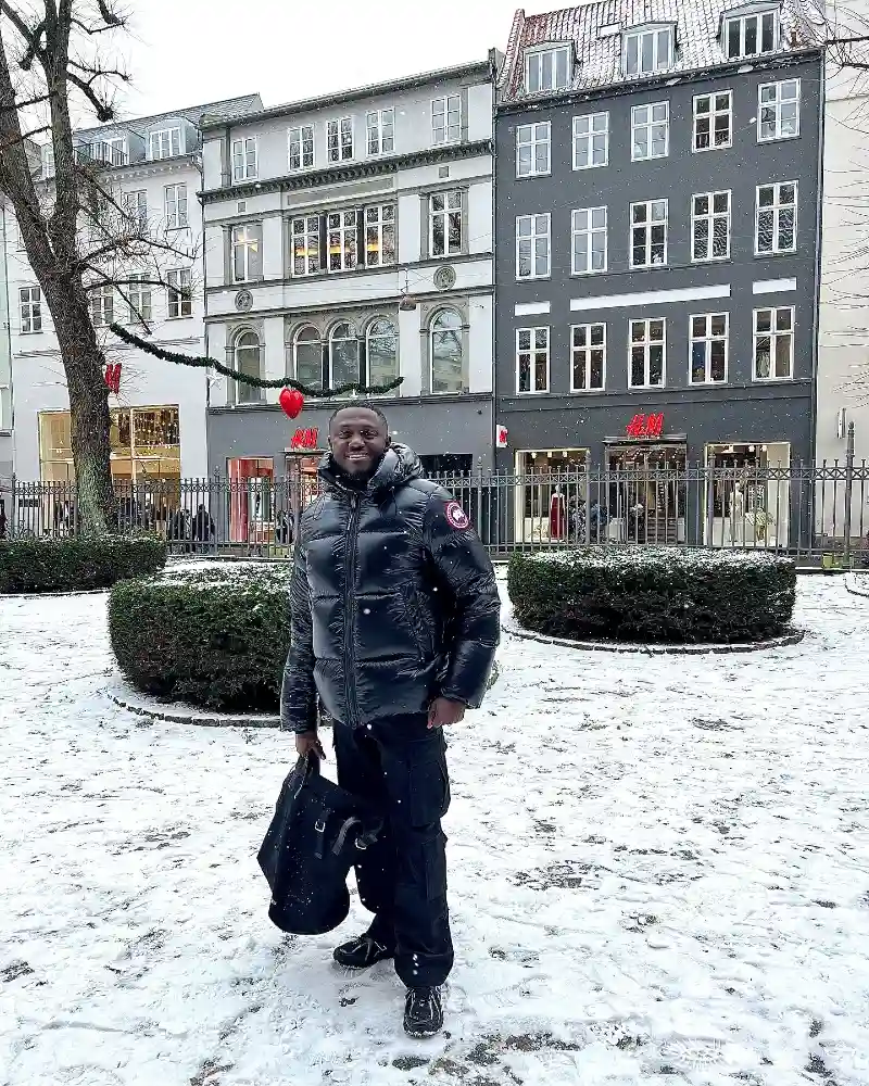Glossy Black Puffer Jacket with Cargo Pants and Boots