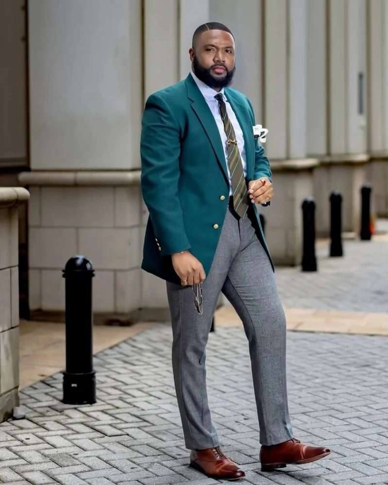 Green Blazer, Striped Tie, and Gray Trousers