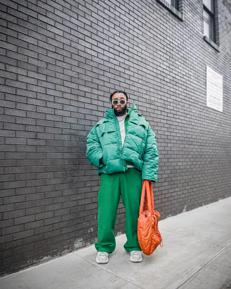 Green Puffer Jacket with Matching Trousers and Orange Bag