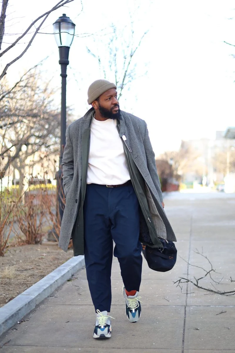 Grey Overcoat with White Sweatshirt and Navy Trousers