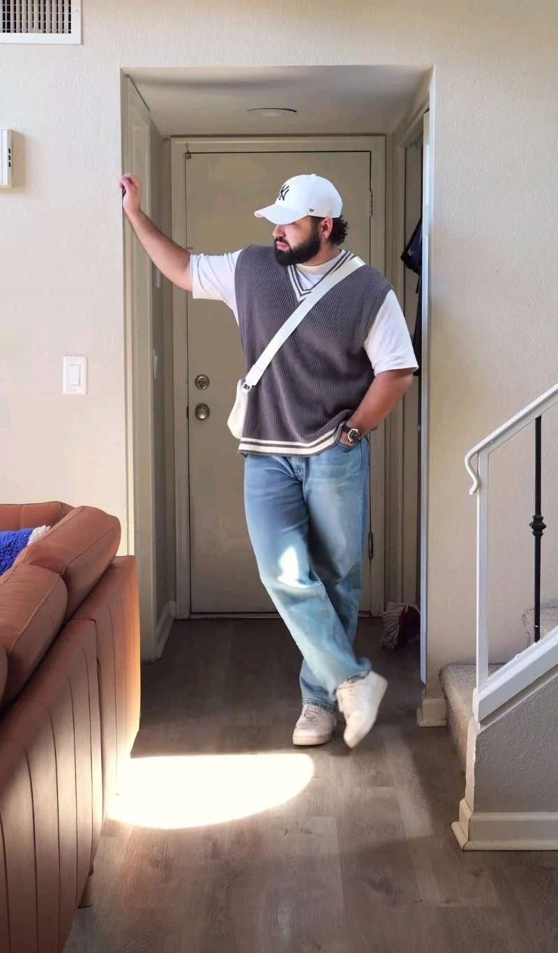 Grey Sweater Vest and Light Blue Jeans