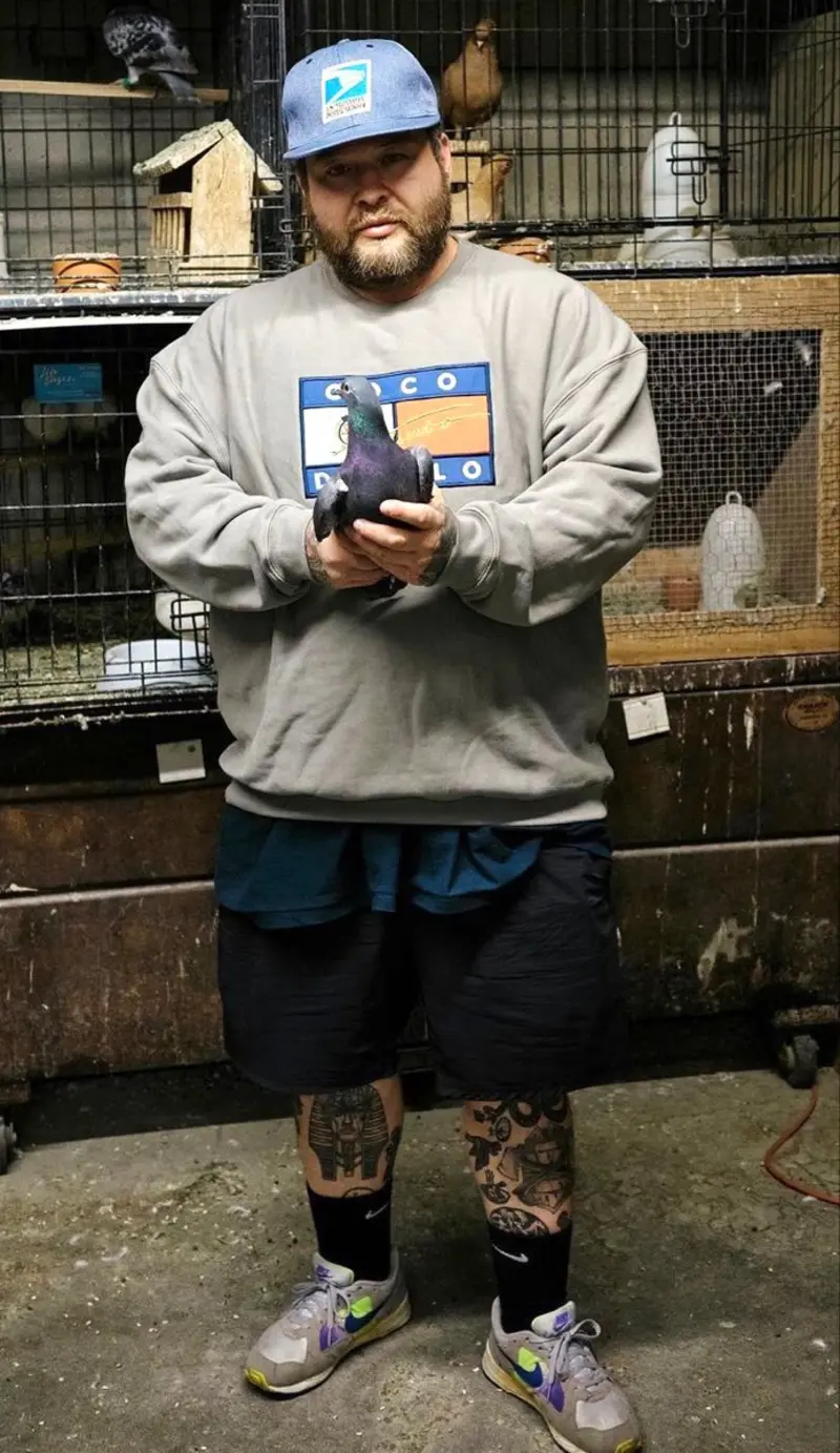 Grey Sweatshirt, Black Shorts, and Light Blue Baseball Cap