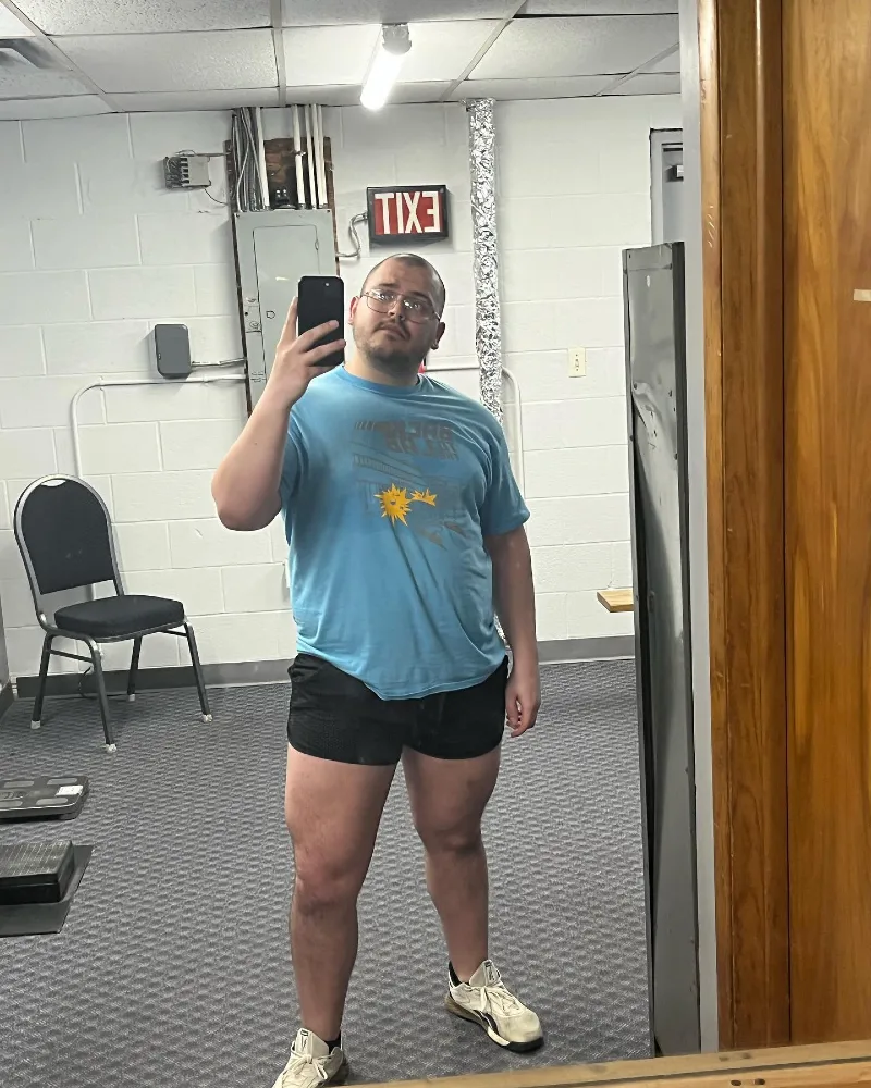 Light Blue Graphic T-Shirt and Black Athletic Shorts