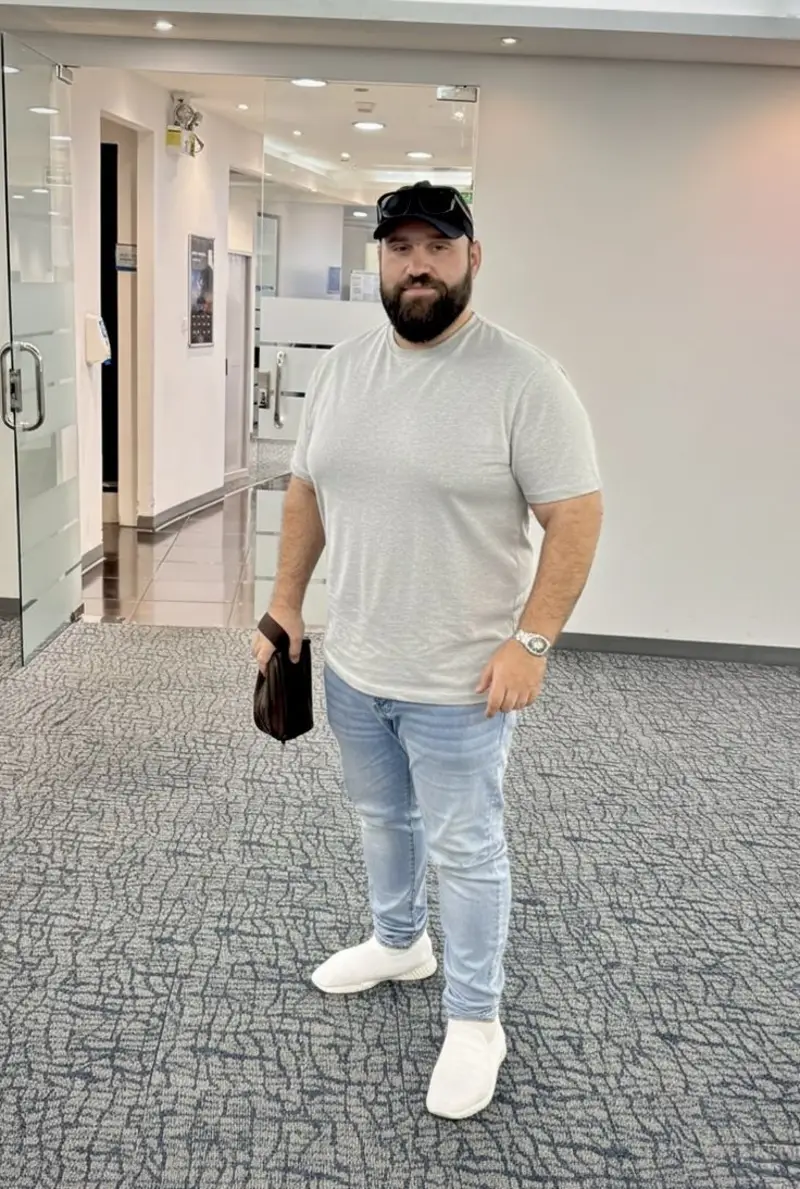Light Grey T-Shirt, Light Wash Jeans, and Black Cap