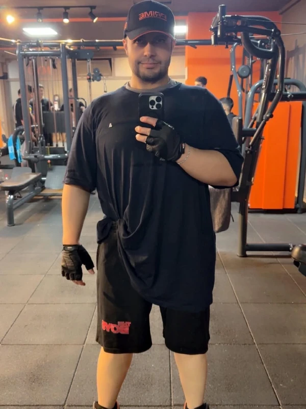 Oversized T-Shirt, Athletic Shorts, and Lifting Gloves