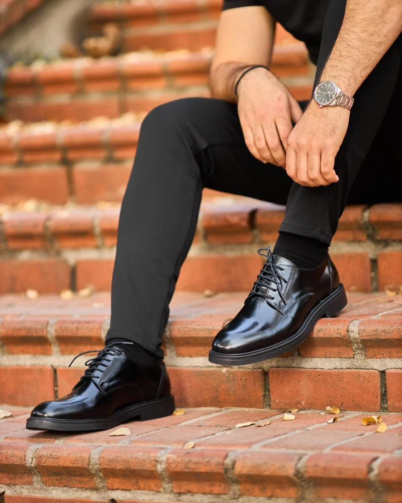 Shiny Black Derby Shoes with Black Trousers and T-Shirt