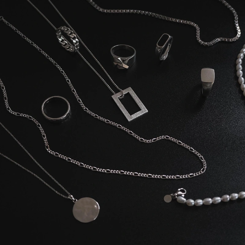 Silver Chains, Rings, and Pearl Necklace