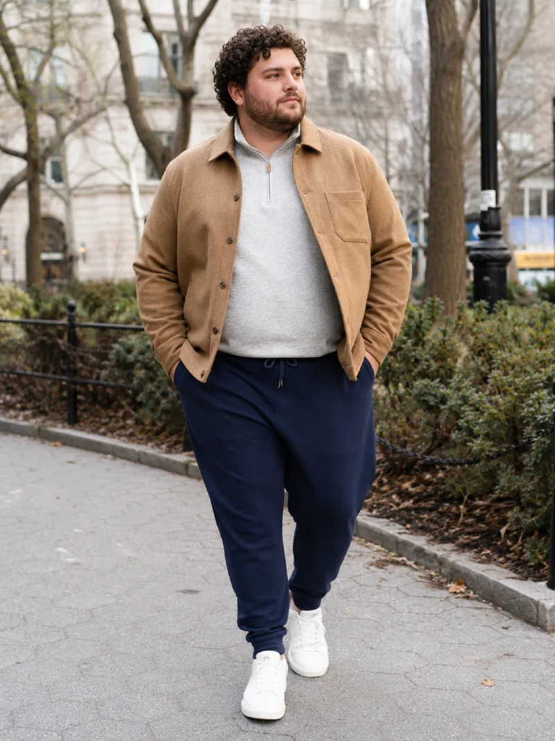 Tan Shirt Jacket, Light Gray Quarter-Zip Pullover, and Navy Sweatpants