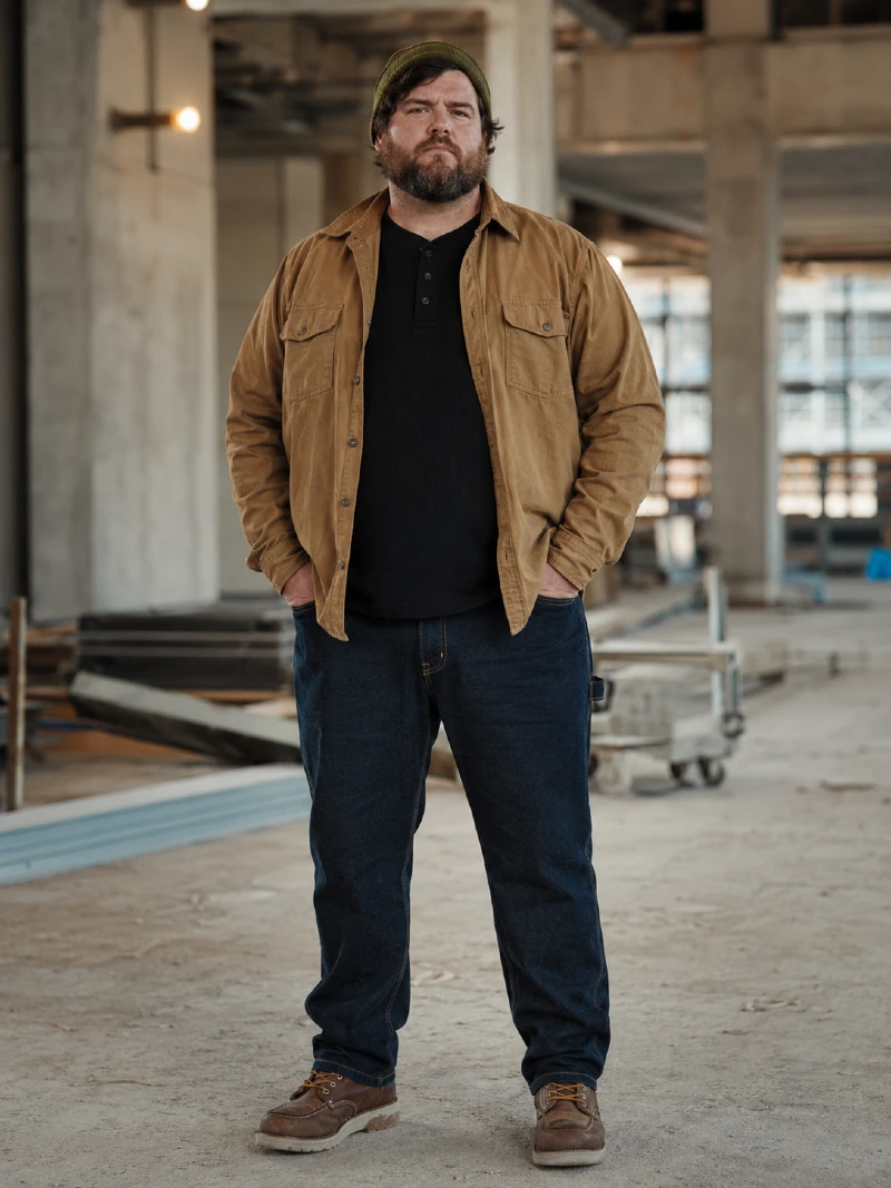 Tan Utility Overshirt with Black Henley, Dark Denim Jeans, and Olive Knit Beanie