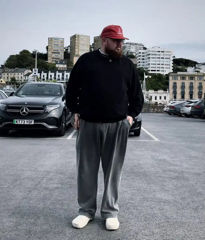 The Black Crewneck Sweatshirt and Grey Track Pants