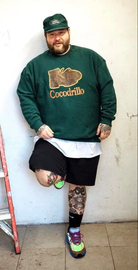 The Green Graphic Sweatshirt and Black Shorts