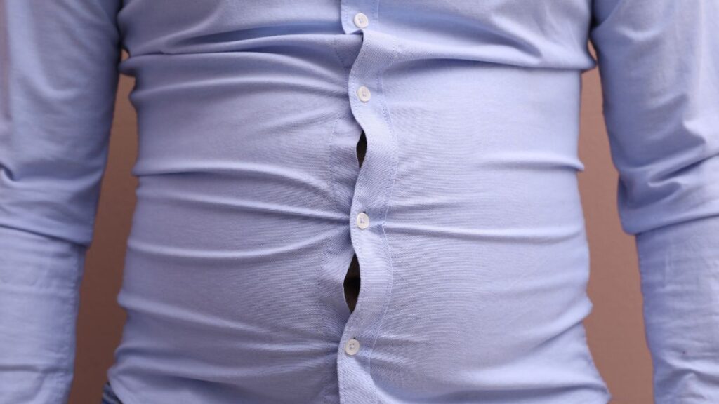 The Shirt That Fits Your Shoulders Will Never Close at Your Belly Why