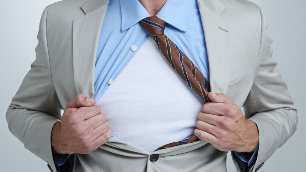 The shirt should skim your chest, not strain across it