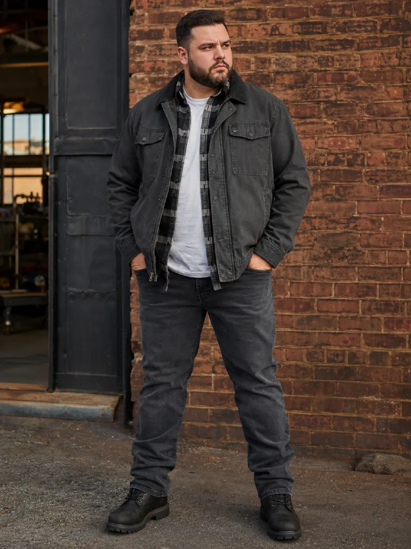 Washed Black Utility Jacket with Plaid Flannel Shirt, White Crewneck T-Shirt, and Charcoal Jeans