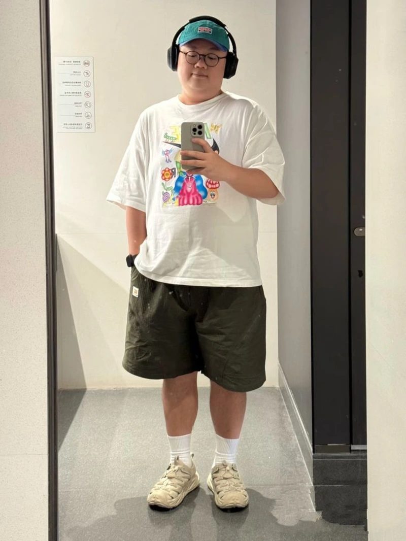White Graphic T-Shirt With Black Shorts