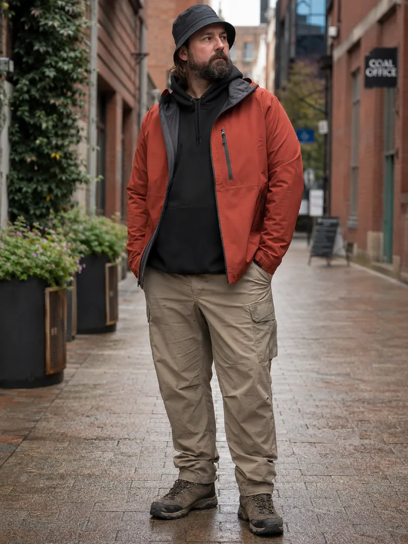 Zip-Up Rain Jacket, Black Hoodie, Khaki Cargo Pants, Bucket Hat, and Hiking Boots